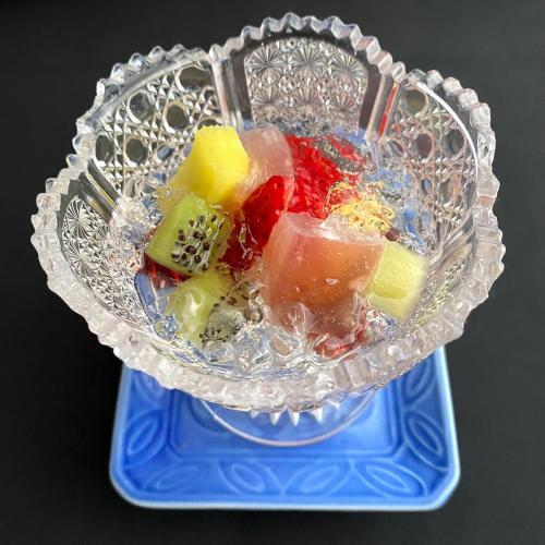 a glass bowl filled with different types of fruit at Honjin in Izunokuni