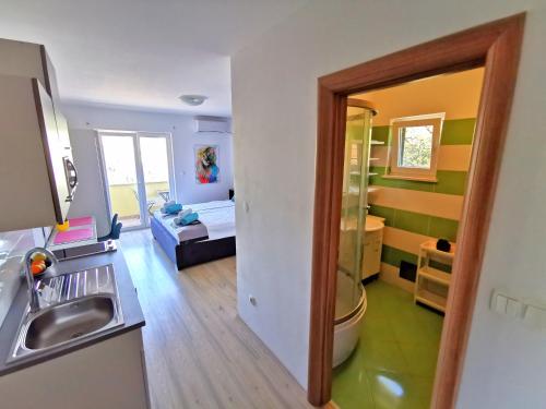 A kitchen or kitchenette at Apartments CVITA HOLIDAY - Villa NATALI