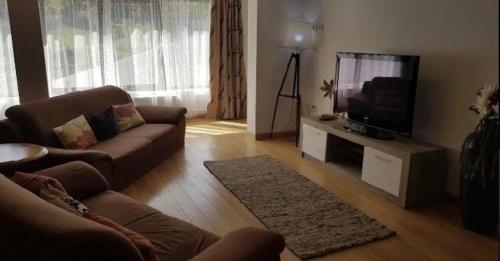 TV a/nebo společenská místnost v ubytování Casa Cris