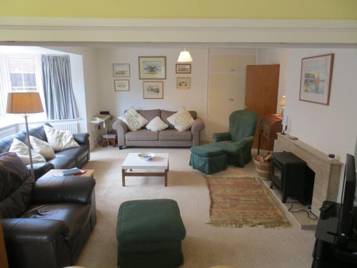 a living room with a couch and a table at 44 Sea Lane in Hunstanton