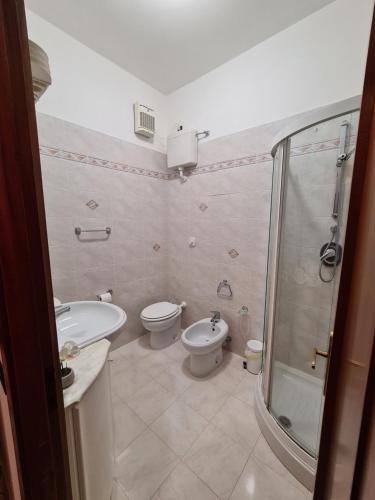 a bathroom with a toilet and a sink and a shower at Casa Della Paola by PortofinoVacanze in Santa Margherita Ligure
