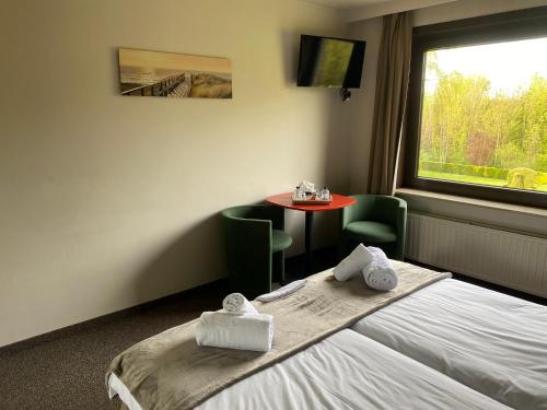Katil atau katil-katil dalam bilik di Hotel de Vaart