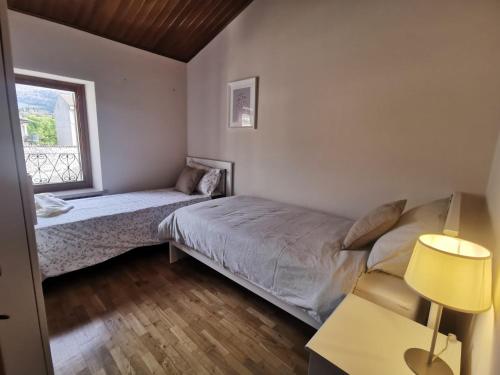 Ένα ή περισσότερα κρεβάτια σε δωμάτιο στο Aurora Appartamenti