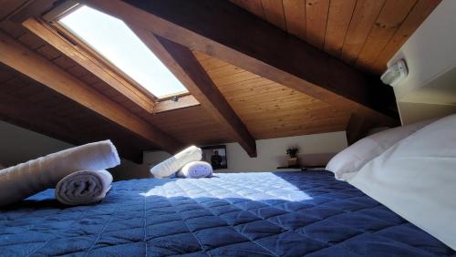 a bedroom with a large bed in an attic at Hotel Adigrat in Riccione