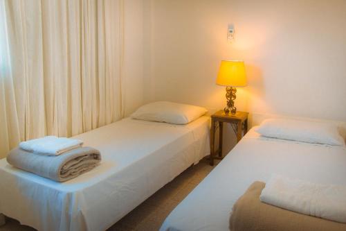 Säng eller sängar i ett rum på Hotel Solar dos Tchuccos