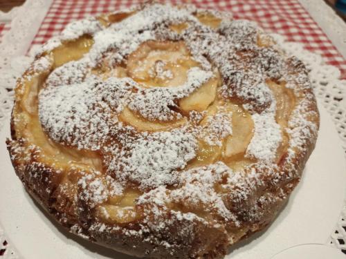 a pastry with powdered sugar on top of it at Agriturismo La Casetta - ospitalità rurale familiare in Montese