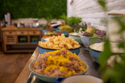 a table topped with bowls of food on a table at Kibbutz Malkiya Travel Hotel in Malkiyya