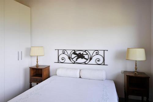Villa Il Leccio tesisinde bir odada yatak veya yataklar