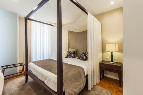 Een bed of bedden in een kamer bij Casas do Porto - Ribeira Apartments