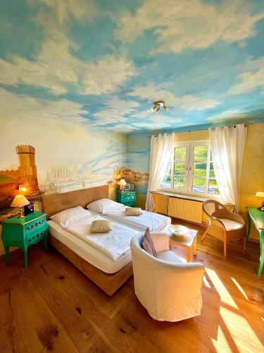 a bedroom with a large bed and a painting on the ceiling at Chalet am Kurpark in Boppard