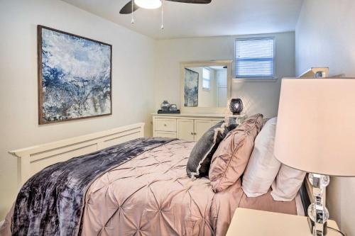 a bedroom with a bed and a mirror at Cozy Rapid City Retreat Perfect for Exploring! in Rapid City