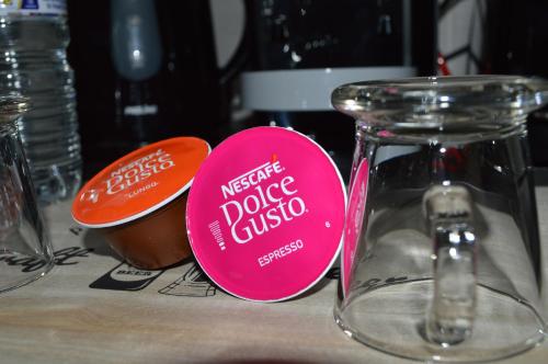 a pink tag sitting on top of a table at Studios Lsquare-Residence in Châtellerault
