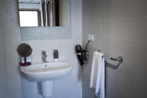 a bathroom with a sink and a mirror at El Tossal in El Castell de Guadalest