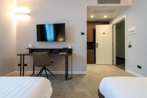 TV a/nebo společenská místnost v ubytování Hotel Ulivi