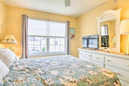 a bedroom with a bed and a window and a television at Deck, Balcony Scenic Ocean View Beach Getaway! in Ocean View
