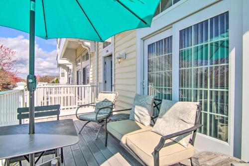 a balcony with chairs and a table and an umbrella at Deck, Balcony Scenic Ocean View Beach Getaway! in Ocean View