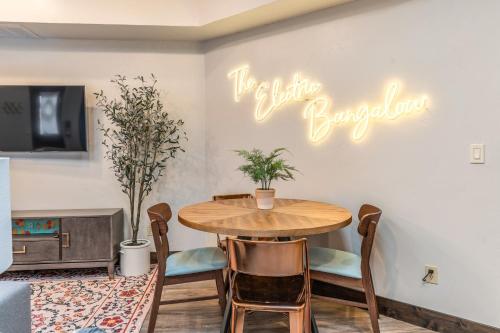 a dining room with a table and a sign that reads the little supper at The Electric Bungalow in Bigfork