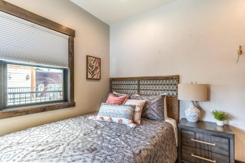 a bedroom with a large bed and a window at The Electric Bungalow in Bigfork