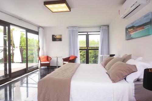 Katil atau katil-katil dalam bilik di Sun Bay Pipa Hotéis