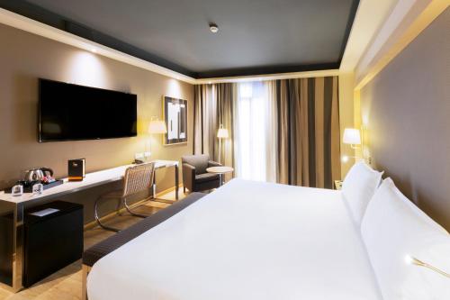 Tempat tidur dalam kamar di Hotel Jazz