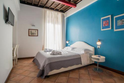 Ένα ή περισσότερα κρεβάτια σε δωμάτιο στο SWEETSUITE Rome