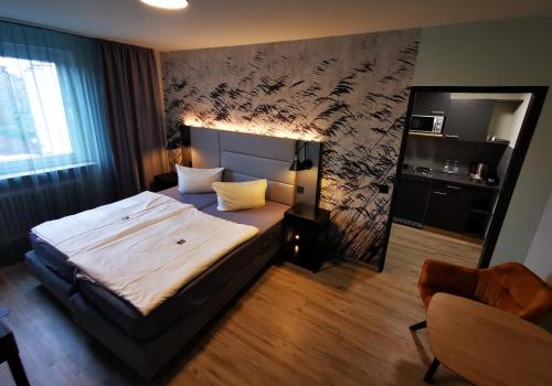 Postel nebo postele na pokoji v ubytování Hotel Grille