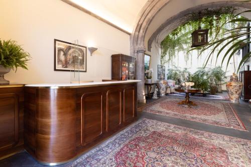 a large room with a wooden bar with a rug at Palazzo Marziale in Sorrento