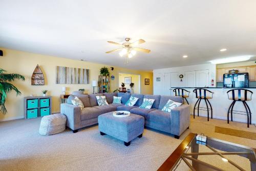 a living room with a couch and a table at Seaside - Silver Lining 202B in Virginia Beach