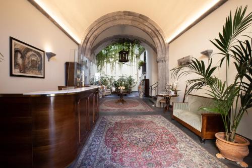 a hallway with a bar in a building with a rug at Palazzo Marziale in Sorrento