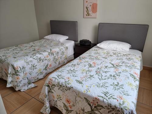 Cama o camas de una habitación en Apart Hotel Doña Esther