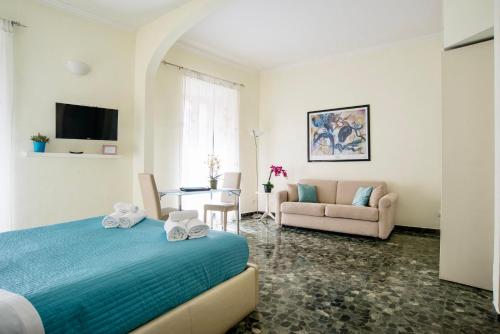 a bedroom with a bed and a living room at SWEETSUITE Rome in Rome