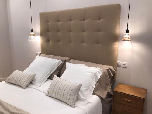 Giường trong phòng chung tại Apartamento Palacio Valdés, centro Avilés, con parking