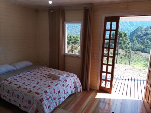 En eller flere senge i et værelse på Cabana Uva Niágara