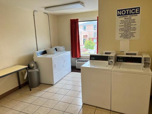 a waiting room with washers and dryers and a window at Motel 6-Biloxi, MS - Ocean Springs in Biloxi