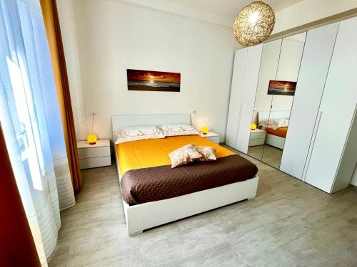 Postel nebo postele na pokoji v ubytování APPARTMENTO per 6 persone A MARINA CENTRO