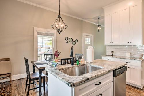 a kitchen with a sink and a counter at Ideally Located Penne Place with Deck and Grill in Greenville