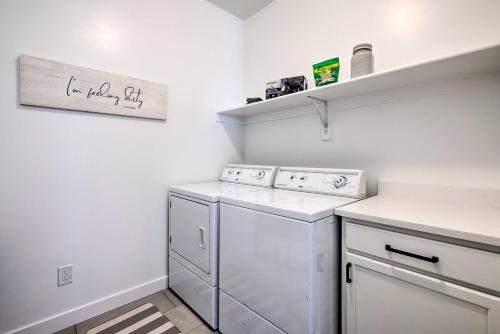 a laundry room with a washer and dryer at Inviting Hideout Townhome with Balcony and Lake Views! in Keetley