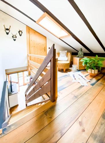 a room with a barn door in a attic at Geographer´s Cottage in Siegsdorf