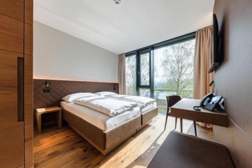 Postel nebo postele na pokoji v ubytování Hotel kommod