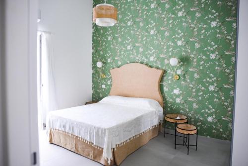 Postel nebo postele na pokoji v ubytování Corso Vittorio Elegant Suites Lipari