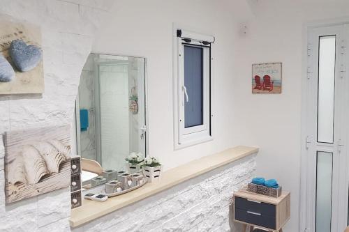 a bathroom with a sink and a mirror at SunnyVillas: 4BR Villa☆Private Pool + Jacuzzi - Villa Amelie in Protaras