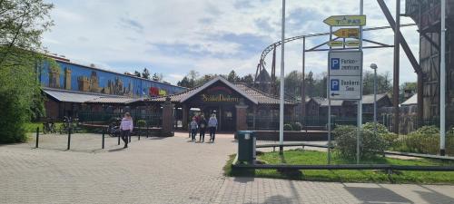 a amusement park with a roller coaster in the background at Ferienwohnung Prinz in Lathen