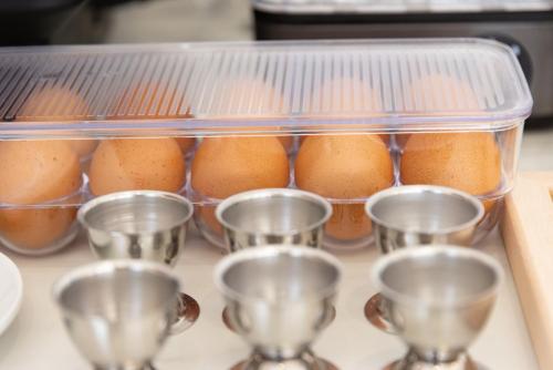 a tray of cups on a counter with oranges at Hotel Edelweiss Riccione in Riccione