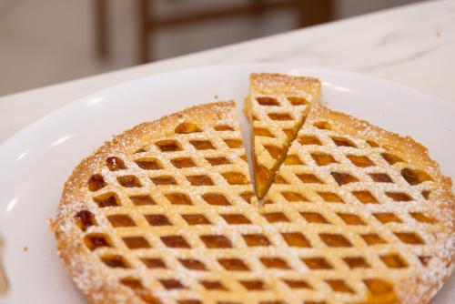 a waffle on a white plate at Hotel Edelweiss Riccione in Riccione