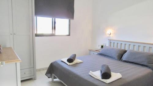 Postel nebo postele na pokoji v ubytování Corralejo Playa