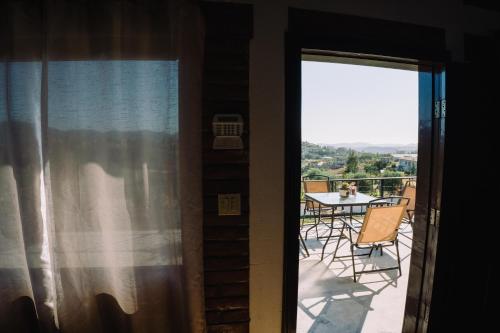 a view of a balcony with a table and chairs at Quinta Sofia Valle de Guadalupe in Valle de Guadalupe