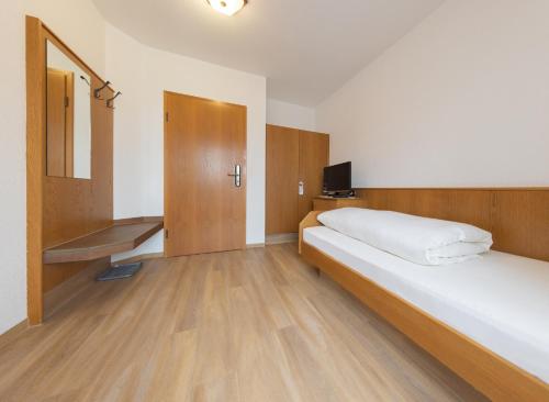 Postel nebo postele na pokoji v ubytování AKZENT Hotel Meerfräulein