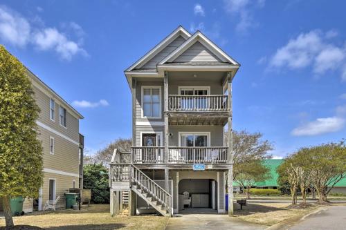 a large house with a balcony on the side of it at Home with Deck in Corolla Light Walk to Beach! in Corolla
