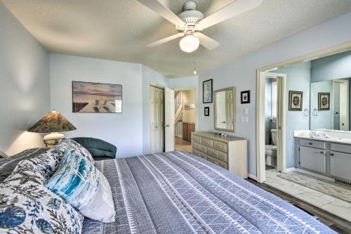 a bedroom with a bed and a ceiling fan at Home with Deck in Corolla Light Walk to Beach! in Corolla