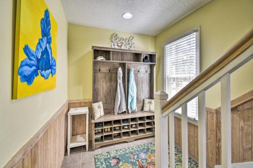 a home hallway with a closet with wooden cabinets at Home with Deck in Corolla Light Walk to Beach! in Corolla